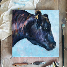 Load image into Gallery viewer, Original oil painting by Leigh Pritchard - Leigh Suzie Art of black angus cow with a blue background.